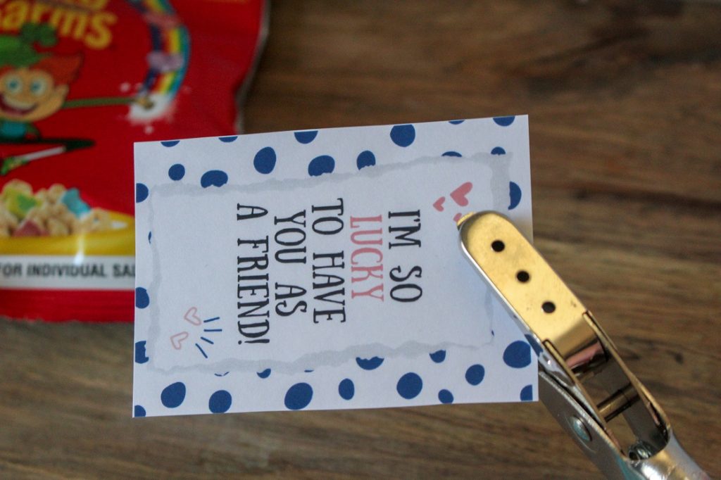 Use the hole punch to put a hole at the top of the printable cereal Valentines.