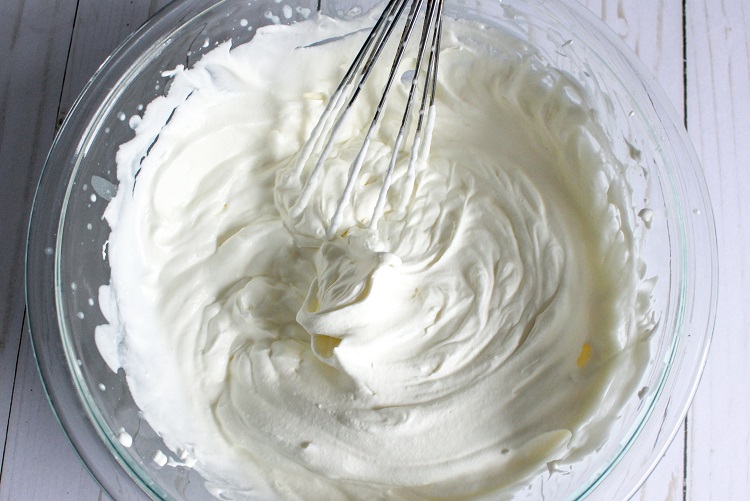 Whip heavy cream until peaks form for step 1 of no churn ice cream.